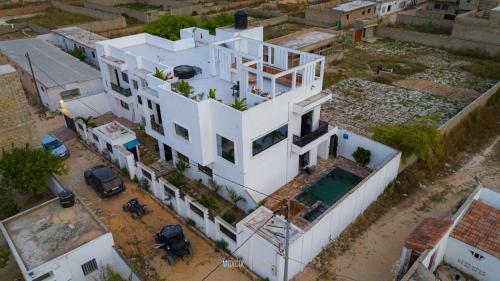 an aerial view of a white house at Villa serenité lac rose avec cuisinier ,piscine et jacuzzi terrasse vue lac in Ouayembame