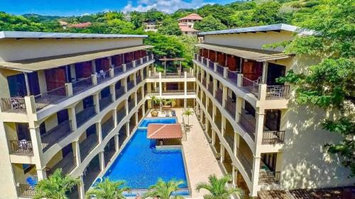 an aerial view of a hotel with a swimming pool at 2-Bedroom, 2-Bath Condo Near Beach in Coco
