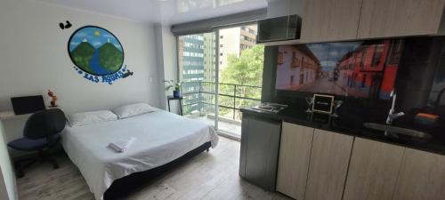 a bedroom with a bed and a flat screen tv at Las Aguas Inner Experience in Bogotá