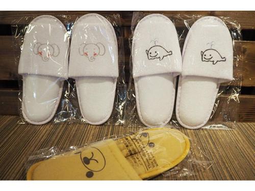 a group of white shoes with hello kitty drawings on them at Hotel Zekkei no Yakata - Vacation STAY 47604v in Takagi