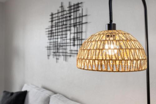 a gold bird cage lamp in a living room at Hines Haven - Unit 2 - Perfect BNB for YOU in Peoria