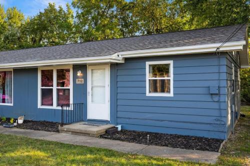 a blue house with a white door at Hines Haven - Unit 2 - Perfect BNB for YOU in Peoria