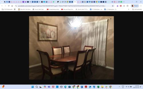 a dining room table and chairs in a room at Room # 2 sleep 4 Arrangement in Edmonton
