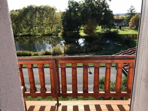a view of a lake from a balcony at Hotel Wettlaufer - sky - in Homberg