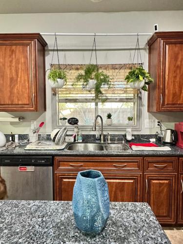 a kitchen with a blue vase sitting on a counter at LAS VEGAS SPACIOUS ROOM Close to Everything in Las Vegas