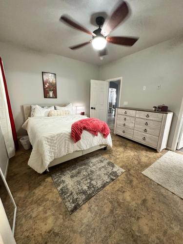 a bedroom with a bed and a ceiling fan at LAS VEGAS SPACIOUS ROOM Close to Everything in Las Vegas