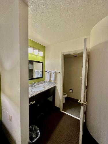 a bathroom with a sink and a toilet at Sleep Inn & Suites Tulsa Central I-44 in Tulsa