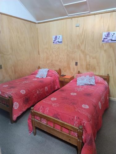 Кровать или кровати в номере Hostal y Residencial El Mundial