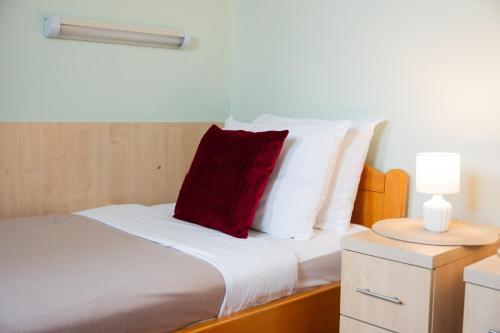 Vukov Park apartmentsにあるベッド