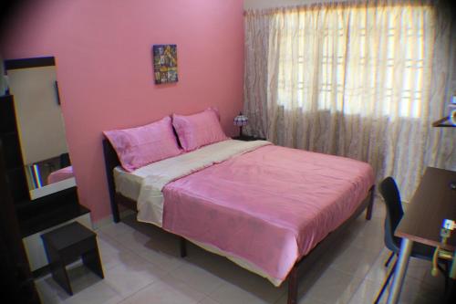 Postel nebo postele na pokoji v ubytování Memory Homestay