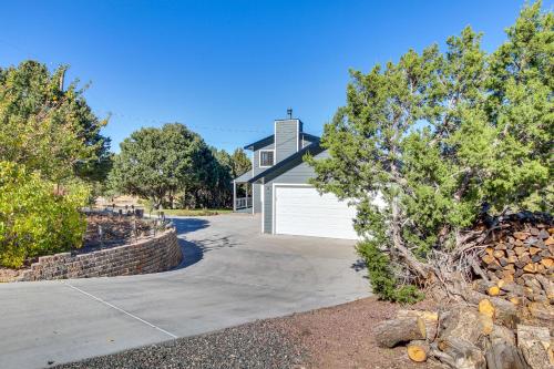 a house with a garage and a driveway at Eagar Vacation Rental Home with Spacious Deck! in Springerville