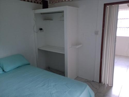 Postel nebo postele na pokoji v ubytování Garifuna Retreat Apartment