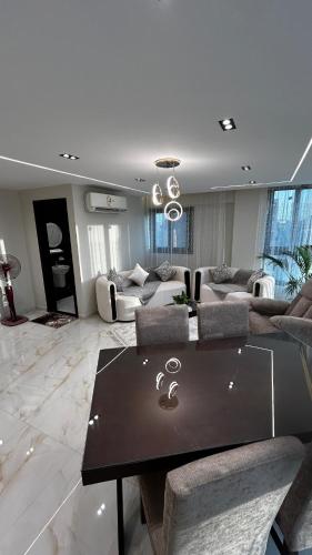 a living room with a couch and a table at Avenu Al-3rab Hotel in Cairo