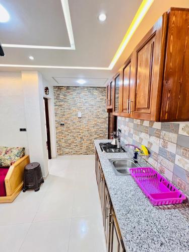 a kitchen with a sink and a counter top at ocean view house in Imsouane