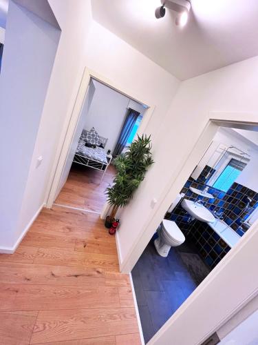 an attic room with a staircase and a toilet at TOP PREMIUM UNTERKUNFT in KÖLN - HÜRTH! in Hürth