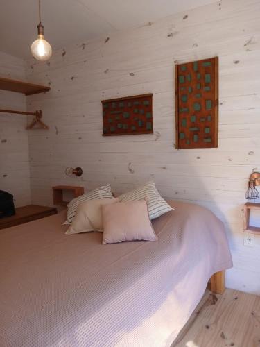 Llit o llits en una habitació de Nio de Baixo