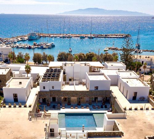 an aerial view of a resort with the ocean at Cavo Piso Livadi in Piso Livadi
