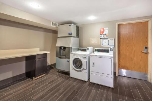 a laundry room with a washer and dryer at Best Western Plus North Las Vegas Inn & Suites in Las Vegas