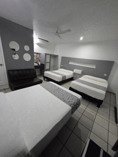 Postel nebo postele na pokoji v ubytování Hotel Raga Inn