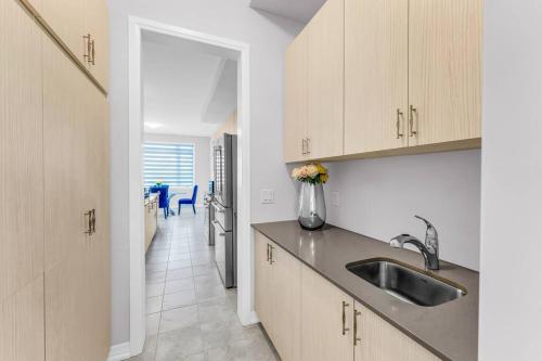 a kitchen with a sink and a counter top at Executive Brand New House 5 Bedrooms and Office in Cambridge