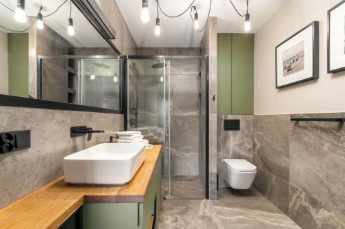 Ένα μπάνιο στο Apartament Dune - frontowy widok na morze w Gardenia