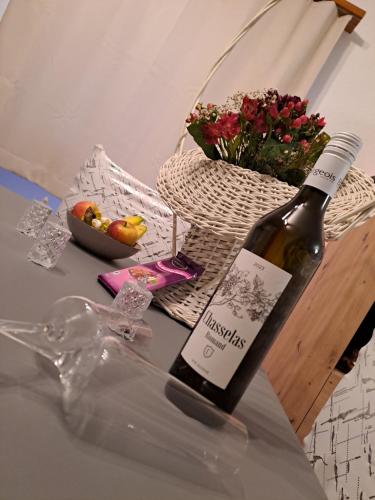 a bottle of wine sitting on top of a table at Vacances en tout tranquillité à Vercorin in Vercorin