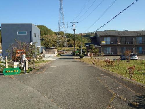 an empty street in a town with a building at Ohana in Minami Aso