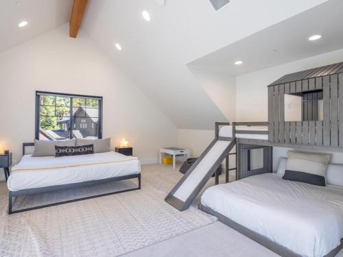 a bedroom with two bunk beds and a staircase at Suncadia 3 Bdrm Home w/Bonus room + Game room in Cle Elum