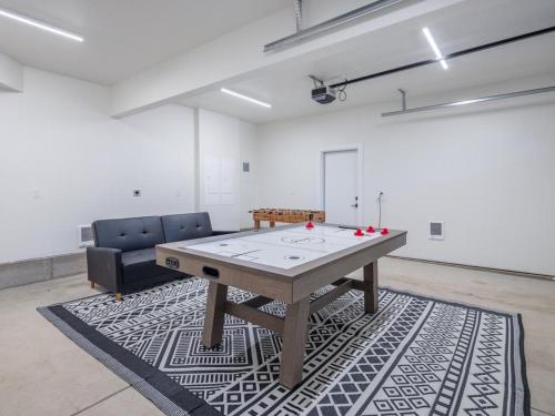 a room with a wooden table and two chairs at Suncadia 3 Bdrm Home w/Bonus room + Game room in Cle Elum