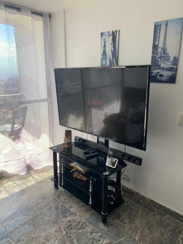 a large flat screen tv sitting on a wall at Calazania in Limoncito
