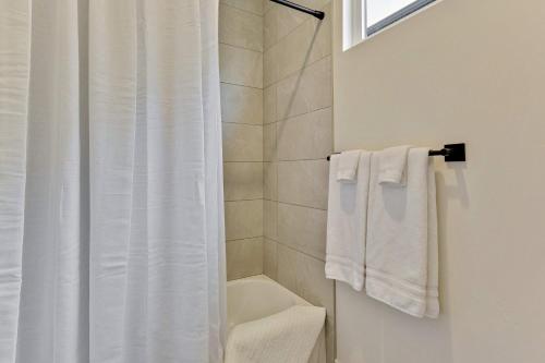 a bathroom with a shower and a white shower curtain at Private HotTub By Copper Rock Golf Course in Hurricane