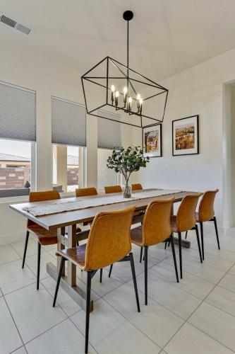 a dining room with a table and chairs at Private HotTub By Copper Rock Golf Course in Hurricane