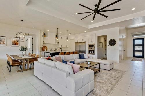 a living room with a couch and a table at Private HotTub By Copper Rock Golf Course in Hurricane