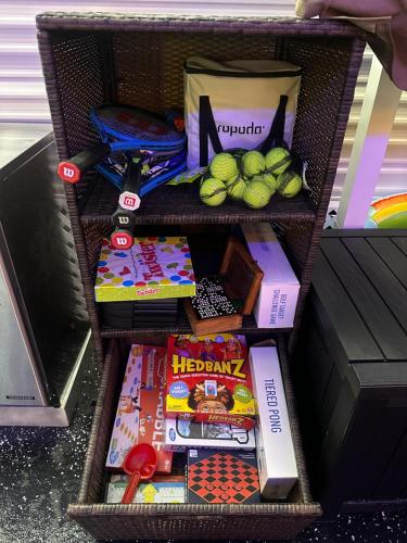 a basket filled with books and other items at Gallego Deluxe Rental in Key Largo
