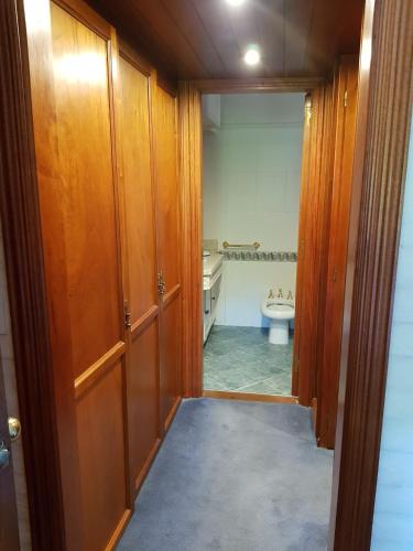 a bathroom with a sink and a toilet in it at Casa con piscina en Piriápolis in Piriápolis