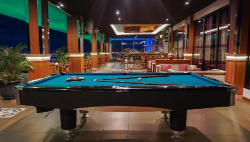 a billiard room with a pool table at Grand Sunshine Resort & Convention in Bandung