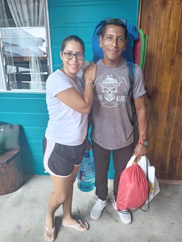 a man and a woman standing in front of a house at Gringo Petes Too in Fortuna