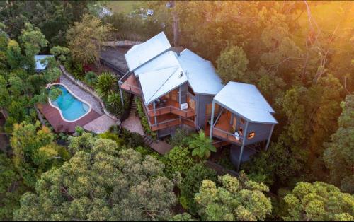 an overhead view of a house in the woods at Gold Coast Mountain Retreat in Mount Tamborine