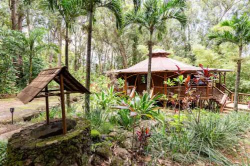 a gazebo in the middle of a garden at Hawaiian Dream Temple in Kaupakulua