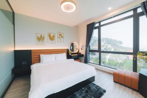 Postel nebo postele na pokoji v ubytování Greenview City Hotel