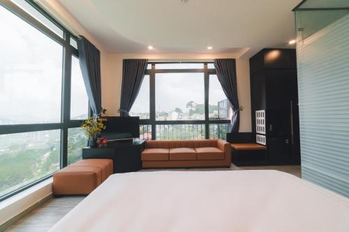 Postel nebo postele na pokoji v ubytování Greenview City Hotel