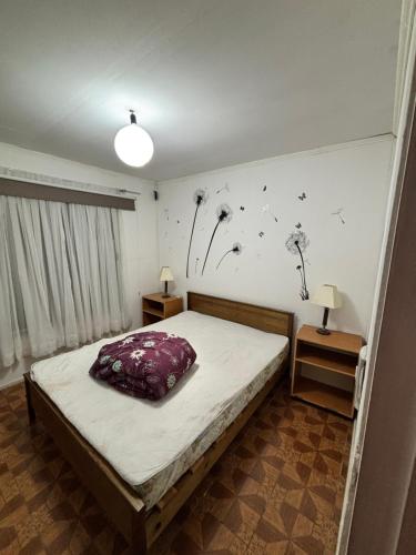 Una cama o camas en una habitación de Hospedaje Quilimari Alto