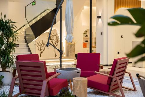 a group of chairs sitting on a patio at Dali Yufu B&B Hotel in Dali Shuanglang
