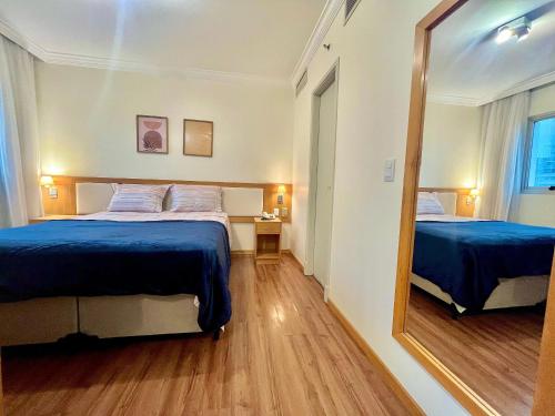 Ένα ή περισσότερα κρεβάτια σε δωμάτιο στο LFlats Hotel Oscar Freire