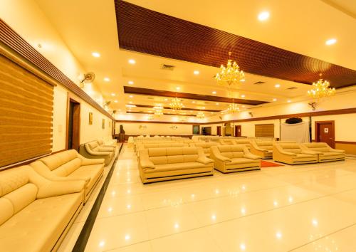a large room with couches and chairs in it at Hotel Royal Palace in Sāgar
