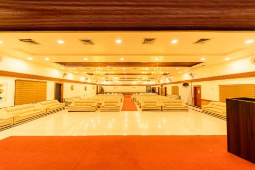 a large room with chairs and a stage in it at Hotel Royal Palace in Sāgar