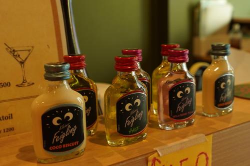 a group of bottles of sauce sitting on a table at Softlight Inn Asakusa Tokyo in Tokyo