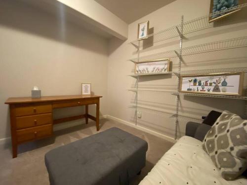 a living room with a desk and a couch at Cozy Two Bedrooms House in Beaverton in Beaverton