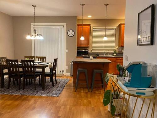 a kitchen and dining room with a table and chairs at Cozy Two Bedrooms House in Beaverton in Beaverton