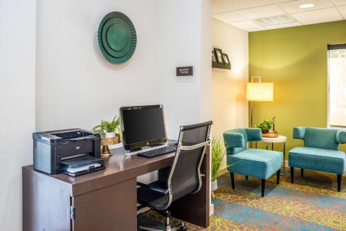 an office with a desk with a computer and chairs at Sleep Inn & Suites Harrisonburg near University in Harrisonburg